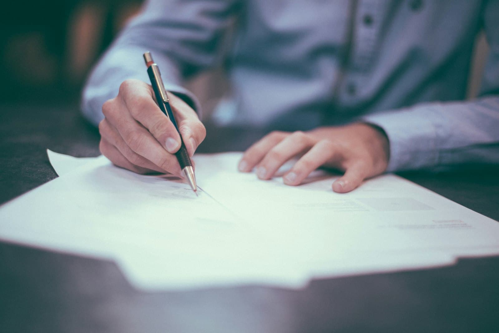 Ledger and pen for Andover catch-up bookkeeping